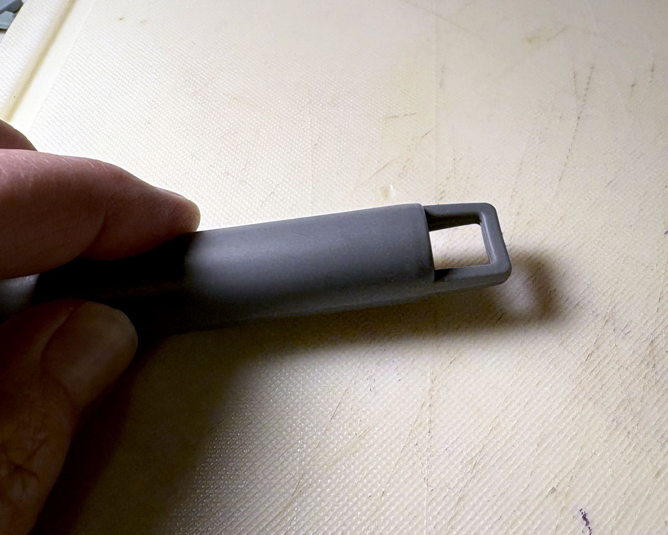 The hook at the base of the handle
